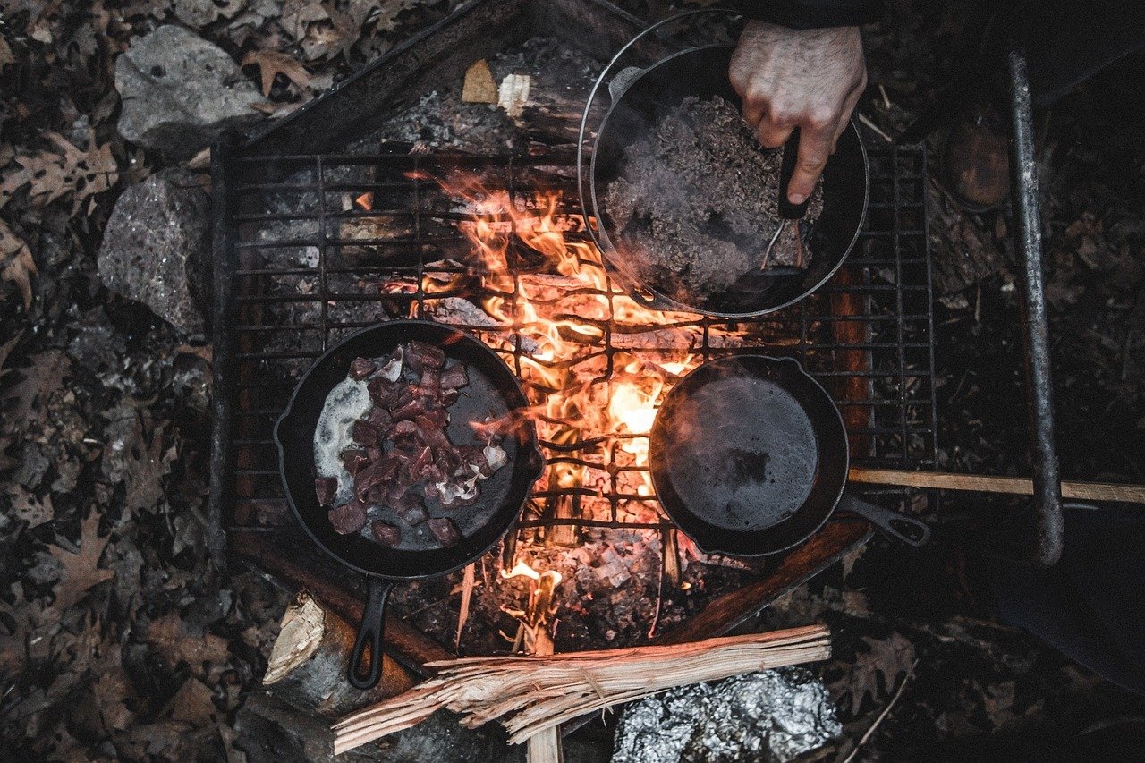 How Do You Prepare And Cook Food Safely In The Wilderness?